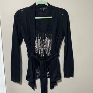 Large women’s faux layer belted sequin sweater top
